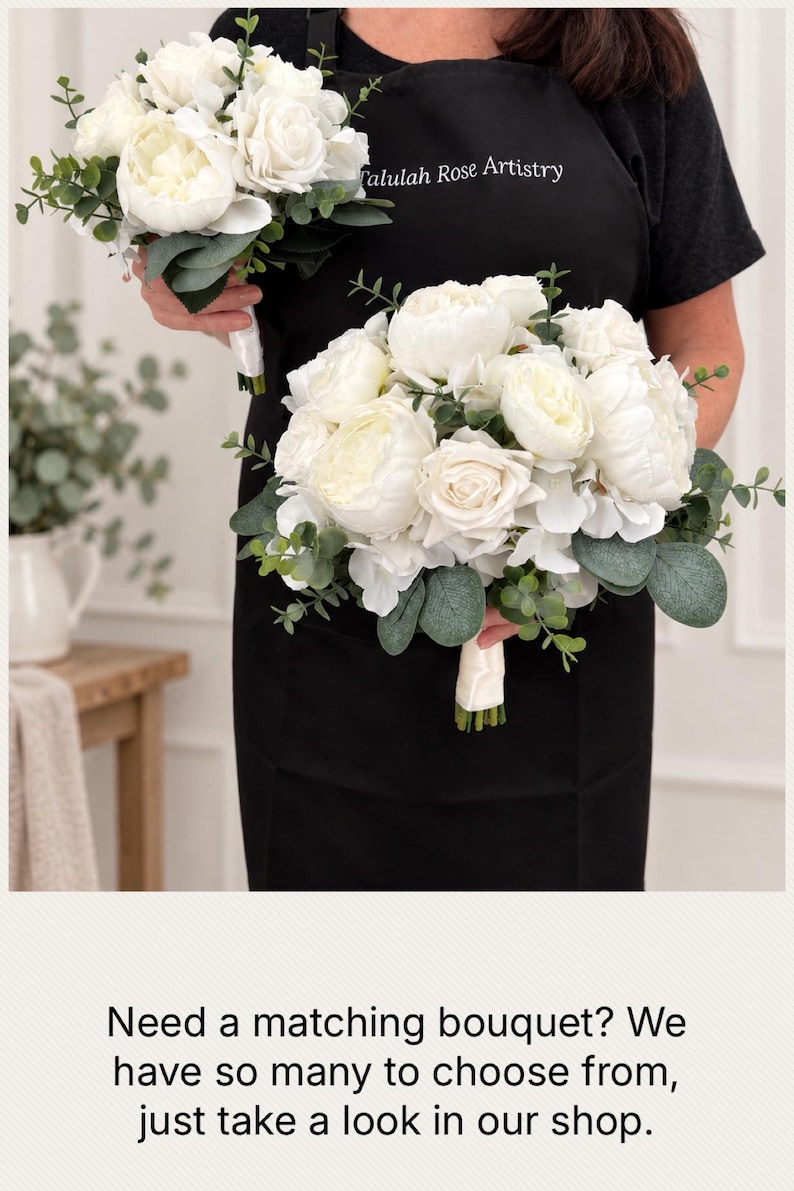 May include: Two artificial floral bouquets featuring white roses, peonies, and hydrangeas accented with green eucalyptus leaves. Each bouquet has a handle wrapped in white satin ribbon. The flowers are arranged in a rounded, full shape.