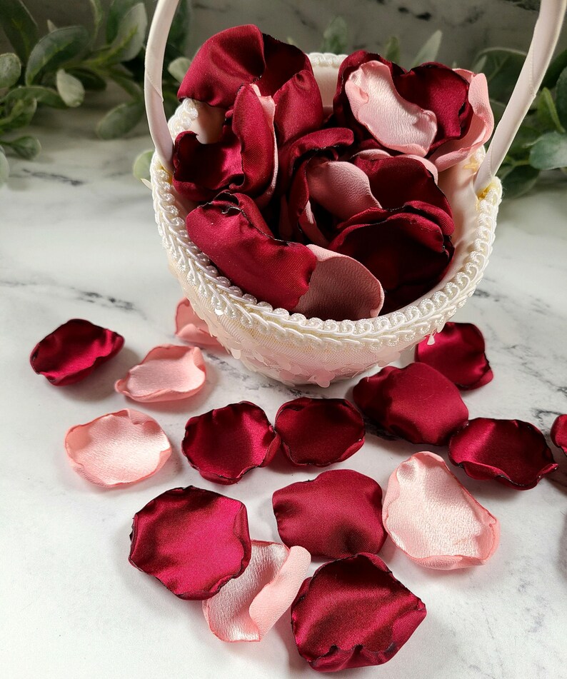 A mix of burgundy, and blush pink rose petals for flower girl petals, baskets, and memory or reception table scatter, backdrop accents, bridal shower decor. For the future bride planning a classic wedding ceremony or fall bridal brunch event.