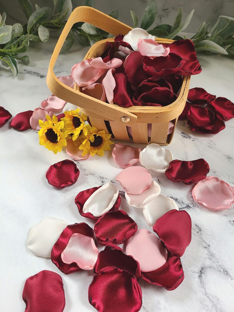 A mix of burgundy, ivory, and blush pink rose petals for flower girl petals, rustic baskets, memory or reception table scatter, backdrop accents, bridal shower decor. For the future bride planning a classic wedding ceremony or fall bridal brunch event.