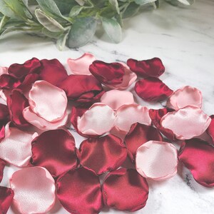 A mix of burgundy, and blush pink rose petals for flower girl petals, baskets, and memory or reception table scatter, backdrop accents, bridal shower decor. For the future bride planning a classic wedding ceremony or fall bridal brunch event.