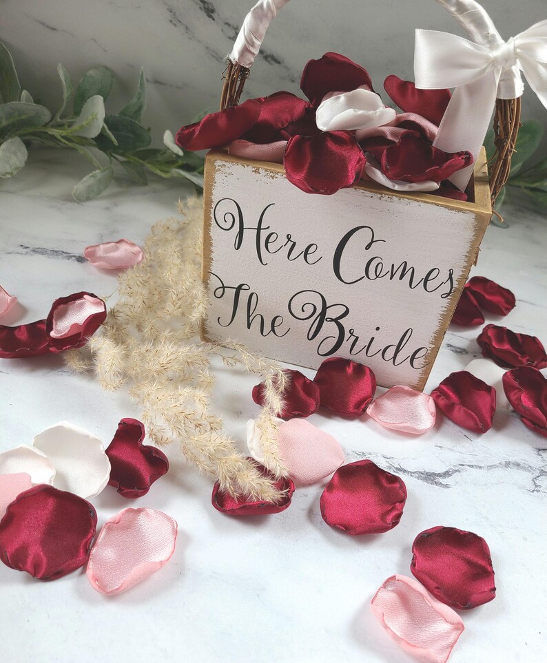 A mix of burgundy, ivory, and blush pink rose petals for flower girl petals, baskets, memory or reception table scatter, backdrop accents, bridal shower decor. For the future bride planning a classic wedding ceremony or fall bridal brunch event.