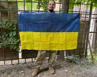 Ukrainian flag with your custom writings on in and some photos of my comrades and UAF fighting vehicles. Order right now & enjoy it!