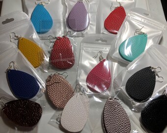 May include: Assortment of 10 pairs of teardrop-shaped leather earrings in various colors, including blue, purple, red, yellow, green, brown, black, white, and pink. The earrings are packaged in individual clear plastic bags.