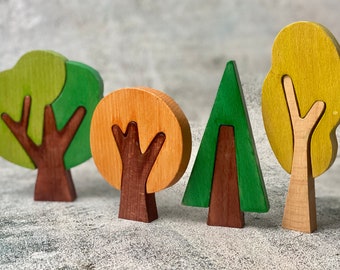 Set of wood puzzle trees toy for creative and educational open ended play 4 seasons play scene woodlands or forest setting