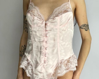Romantic pastel pink button up bodysuit with lace