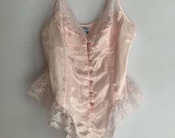 Romantic pastel pink button up bodysuit with lace