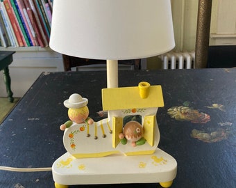 Vintage IRMI nursery lamp of a boy and a girl in a shoe house with night light