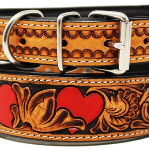 May include: A brown leather dog collar with red hearts and floral tooling. The collar has a silver buckle and D-ring.