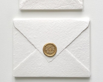 Handmade cotton envelopes with uneven edges. White