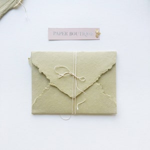 Handmade cotton envelopes with uneven edges. send