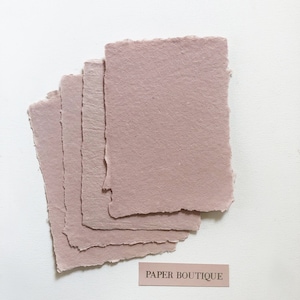 Handmade cotton paper with uneven edges. Dusty rose