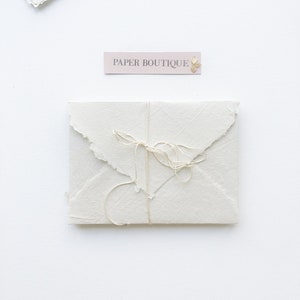 Handmade cotton envelopes with uneven edges. Beje