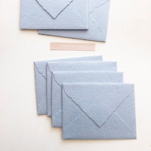 Handmade cotton envelopes with uneven edges. light blue