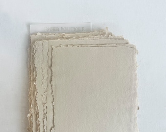 Beije cotton rag paper with uneven edges.