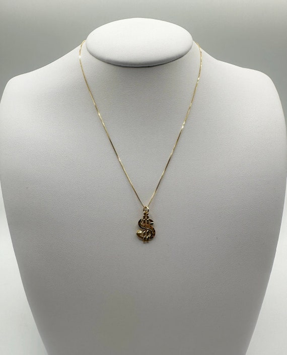 Collana con simbolo del dollaro per 1,80