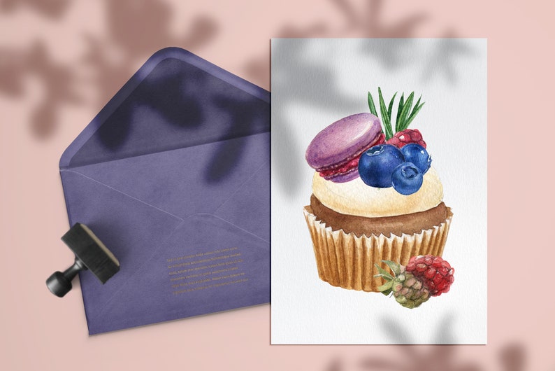 May include: Watercolor illustration of a cupcake topped with a purple macaron, blueberries, and raspberries. A purple envelope and stamp are in the background. The cupcake has a white frosting and a brown base.