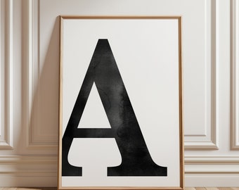 May include: A black and white framed print of the letter A in a bold, sans-serif font. The letter is stylized with a watercolor effect, giving it a textured appearance.