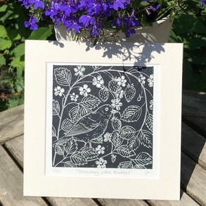 Lino print of a Blackbird in strawberry plants, an original limited edition linocut print, hand printed in Yorkshire.