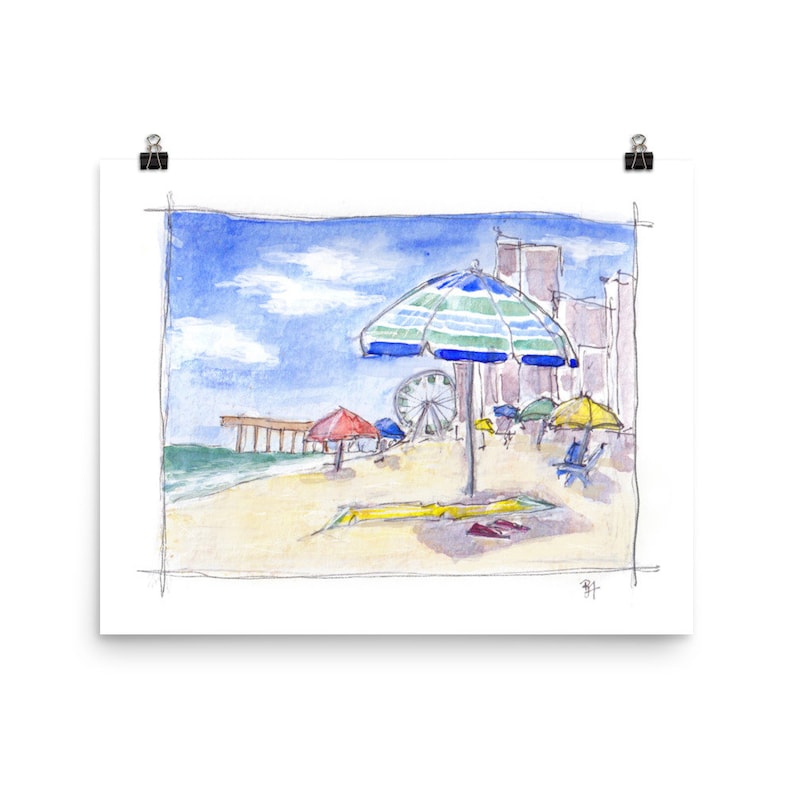 May include: A watercolor painting of a beach scene with a blue and green striped umbrella, red and yellow umbrellas, a pier in the background, and a Ferris wheel.