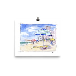 May include: A watercolor painting of a beach scene with a blue and white striped umbrella, red and yellow umbrellas, a Ferris wheel, and a pier in the background.