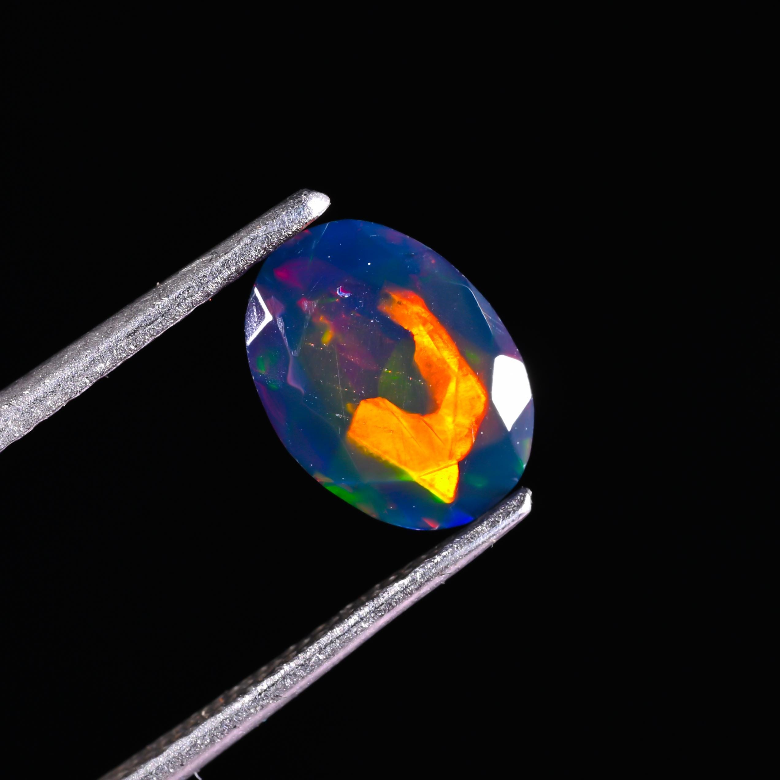 RARE !! OPALE NOIRE ET MULTICOLORE D'ETHIOPIE : 1,57 CARAT