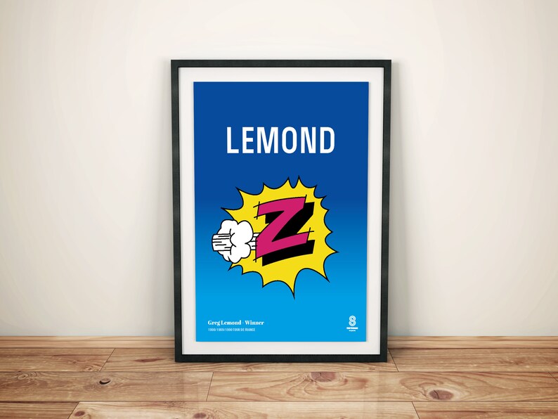K&ouml;nnte beinhalten: Gerahmter Kunstdruck mit dem Wort "LEMOND" in wei&szlig;en Gro&szlig;buchstaben auf blauem Hintergrund. Ein Comic-Stil "Z" in Pink und Schwarz befindet sich in einem gelben Burst. Der Druck enth&auml;lt Text unten und ist in einem schwarzen Rahmen.