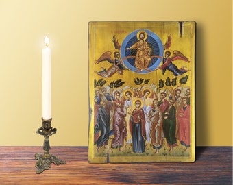 May include: A vintage-style icon depicting Jesus Christ ascending to heaven surrounded by angels and disciples. The icon is painted on a wooden panel with gold accents and features a vibrant color palette.
