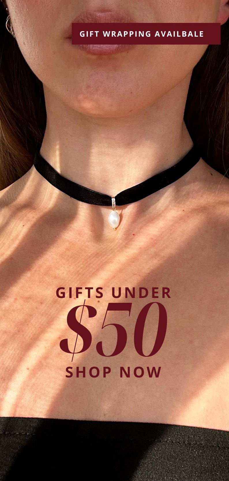 May include: A black velvet choker necklace with a single white pearl pendant. The text "GIFTS UNDER $50 SHOP NOW" is displayed below the necklace.