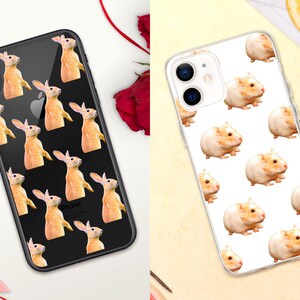 May include: Two phone cases with different animal designs. The first case is black with a white "iPhone" logo and features a pattern of orange rabbits. The second case is clear with a white background and features a pattern of brown hamsters.
