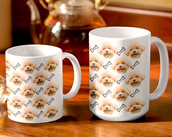 May include: Two white ceramic mugs with a repeating pattern of a small dog's face and a bone. The mugs are on a wooden surface.