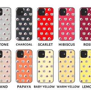 May include: Ten different phone cases with a repeating pattern of a cat's face. The cases are in the colors: stone, charcoal, scarlet, hibiscus, rose, sand, papaya, baby yellow, warm yellow, and lemon.