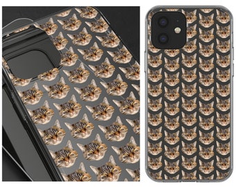 May include: A clear phone case featuring a repeating pattern of cat faces. The case is designed for a smartphone with a camera bump on the back.