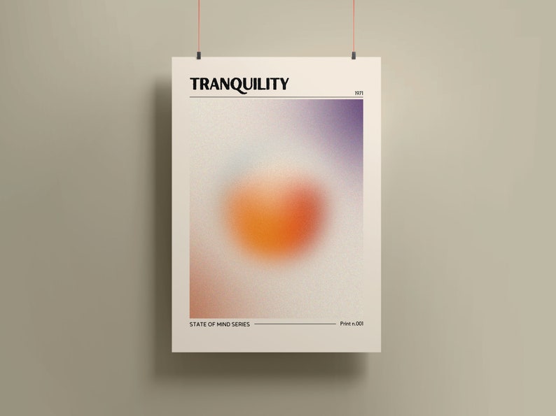 May include: A poster with the text "TRANQUILITY" in black text on a white background. The poster features a blurred orange and purple circle in the center. The text "STATE OF MIND SERIES" and "Print # 001" are at the bottom of the poster.
