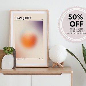 May include: A framed print with a blurred orange and purple design. The print is titled "TRANQUILITY" and is part of a "State of Mind Series". A 50% off sale is advertised for purchases of 3 prints or more.