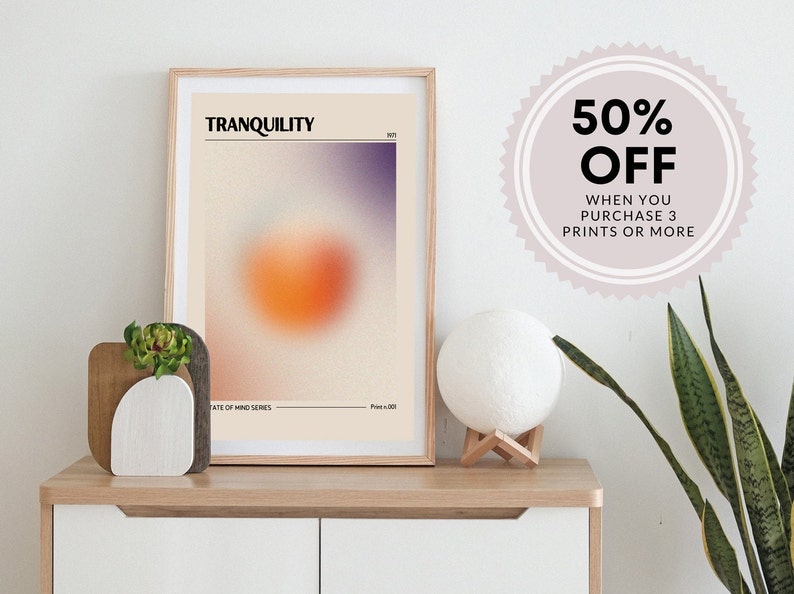May include: A framed print with a blurred orange and purple design. The print is titled "TRANQUILITY" and is part of a "State of Mind Series". A 50% off sale is advertised for purchases of 3 prints or more.