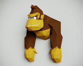 May include: A brown and yellow papercraft model of a gorilla, with a detailed face and a textured, folded paper design.