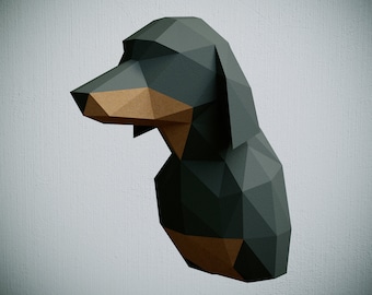 May include: A black and brown papercraft dachshund sculpture. The sculpture is made of folded paper and has a geometric design.