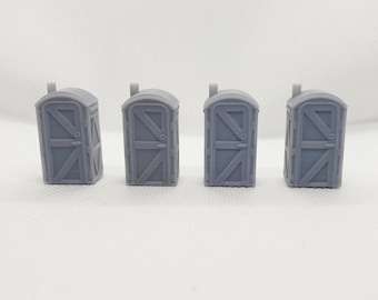 May include: Four gray plastic portable toilets with a door and a small roof. The toilets are arranged in a row.