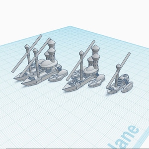 Puede incluir: Tres modelos de barcos en miniatura con torres, cada uno con un tamaño y detalles diferentes. Los barcos están hechos de plástico gris y tienen un tema náutico.