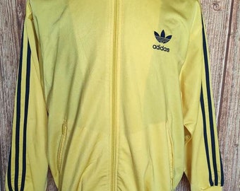 blue adidas jacket with yellow stripes