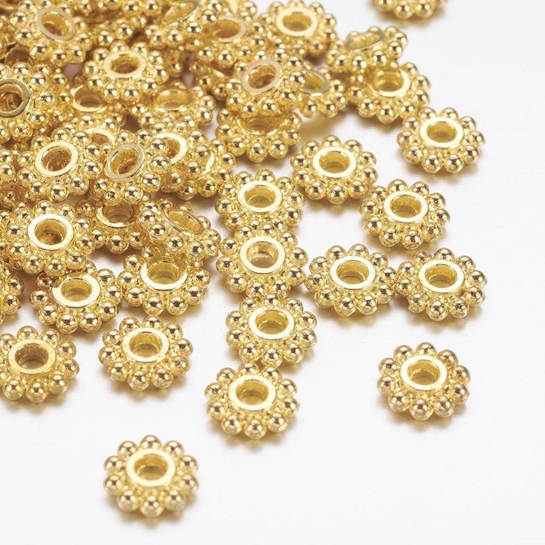 50 gold metal flower spacer beads 6.5mm image 1