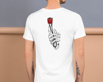 May include: White t-shirt featuring a black and white illustration of a skeleton hand holding a red box with the text "Vintage 1943" on it.