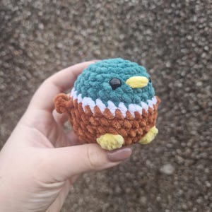 Handmade amigurumi mallard duck plush showing detailed stitching