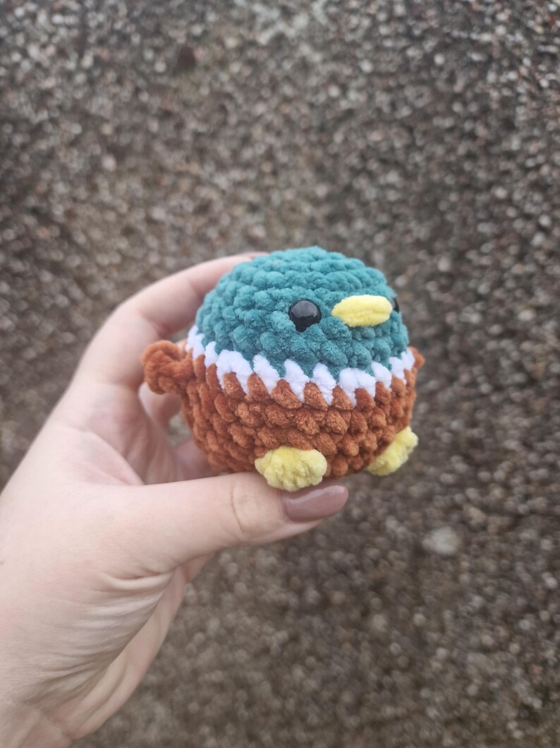 Handmade amigurumi mallard duck plush showing detailed stitching