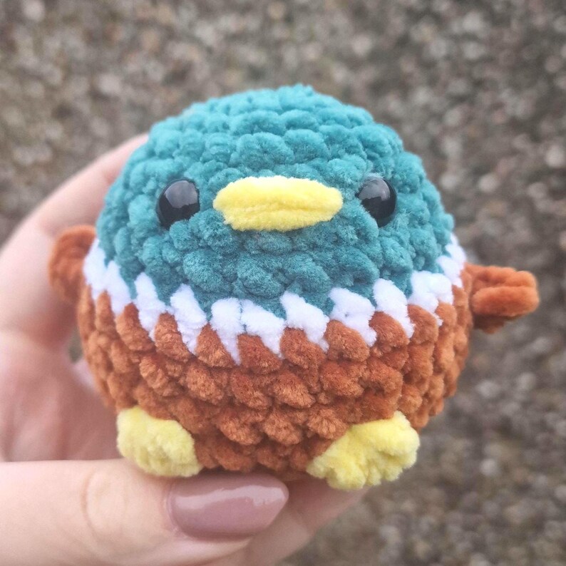Front view of cute handmade mallard duck plush with yellow feet