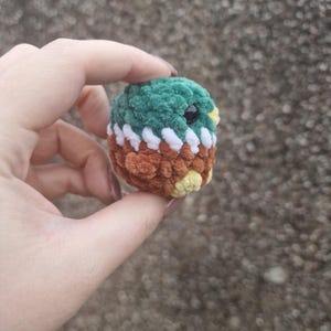 Back view of small amigurumi mallard duck plush toy
