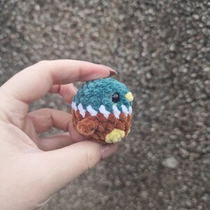 Small handmade mallard duck plush toy showing front view and tiny feet