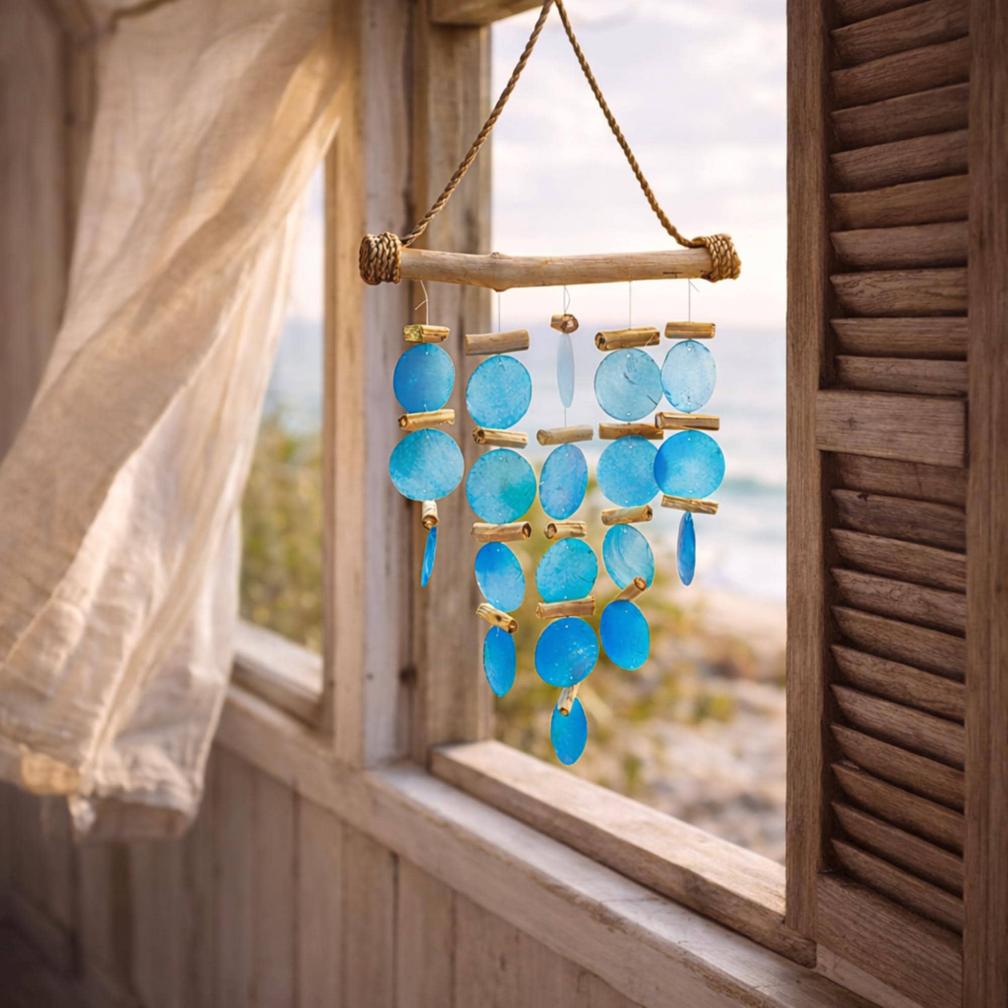 Solange & Frances Shell Wind Chimes. This Capiz Shell Wind Chime is