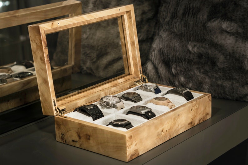 Luxury mapa burl watch box for 8 watch sideview with open cover and white pillows and fabric inside