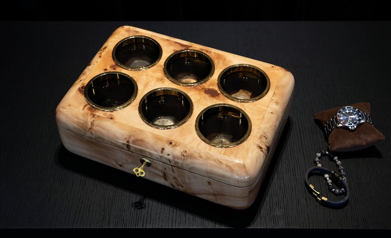 Mapa burl watch box with brown pillow